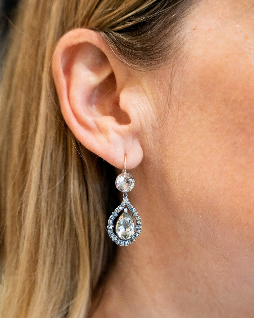 White Paste Earrings being worn by a model to show the scale. 