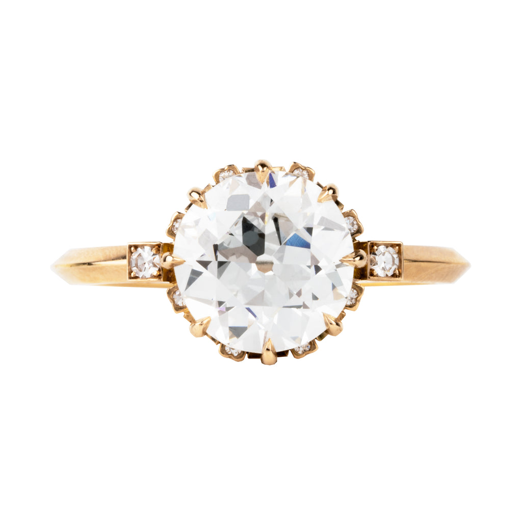 One of our signature Bell and Bird designs.This solitaire ring features a main round old European cut diamond surrounded by 8 single-cut diamonds subtly peeking out from underneath the main stone. There are two additional single-cut diamonds at the base of the whisper-thin, hand-filed knife edge band.&nbsp; Set in our 18k old gold. This ring features a GIA certified 2.27 carat I color and VS2 clarity old European cut diamond. Handcrafted in our 18k old gold.